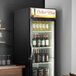 A Beverage-Air black glass door wine refrigerator full of wine bottles.
