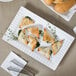 A CAC porcelain platter with triangle shaped pastries filled with spinach.