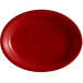 A red oval Tuxton china platter with a white background.