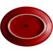 A red oval platter with a white rim.