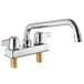 A Regency chrome deck mount faucet with two handles and a 10" swing spout.
