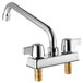 A chrome Regency deck-mount faucet with two brass handles and a 10" swing spout.
