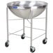A large stainless steel Vollrath mixing bowl on a stainless steel mobile stand.