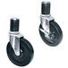 A pair of black casters with metal plates and wheels.