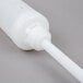 A white plastic tube with a long tube.