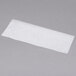 A close-up of a white rectangular piece of Durable Packaging wax paper.
