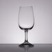 A close up of a clear Stolzle INAO wine glass.