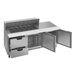 A stainless steel Beverage-Air sandwich prep table with open drawers.