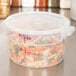 The translucent lid for a Cambro food storage container.