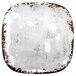 A white square melamine plate with brown speckles.