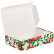 A white candy box with red and green poinsettia floral designs.