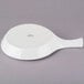 A white round Tuxton China fry pan server with a handle.