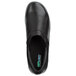 A close-up of a black SR Max slip-on women's shoe with a green logo.