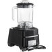 A black AvaMix commercial blender with a cord attached to it.