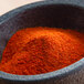 A bowl of Regal extra hot ground cayenne pepper powder.