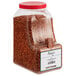 A white container of Regal Mild Crushed Red Pepper.
