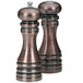 A close-up of a brown metal Chef Specialties salt and pepper shaker set.