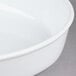 A close up of a white CAC porcelain oval deep dish serving platter.