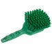 A close-up of a Carlisle green Sparta utility and pot scrub brush with long green bristles.