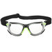 3M Solus safety goggles with green and black accents and a clear lens with a strap.