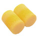 A close-up of a pair of yellow earplugs.
