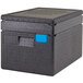 A black Cambro Cam GoBox top loading food pan carrier with blue tape on it.