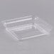 A clear plastic lid for a Durable Packaging 8" square foil cake pan.