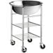A silver stainless steel mixing bowl on a metal stand with wheels.