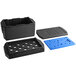 A black plastic Cambro food pan carrier with blue plastic pieces inside.
