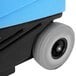 A blue and black Mytee Grand Prix automotive extractor with a wheel on a blue container.