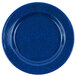 A medium blue Crow Canyon Home enamelware plate with a speckled surface and wide rim.