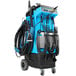 A blue and black Mytee carpet cleaner with hoses.