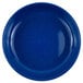 A medium blue Crow Canyon Home enamelware plate with white speckles.