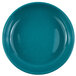 A Crow Canyon Home turquoise speckled enamelware pasta plate with a rim.