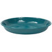 A turquoise Crow Canyon Home Stinson enamelware pasta plate with speckled surface.