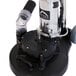 A black and silver Mytee T-REX-230 rotary carpet extractor on a table.