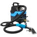 A blue and black Mytee carpet shampooer with a hose.