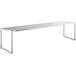 A stainless steel long rectangular shelf for an Avantco table.