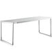 An Avantco stainless steel single deck overshelf on a white table with metal legs.