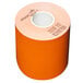 A roll of MAXStick orange thermal paper with a white circle in the middle.