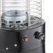 A black Backyard Pro portable patio heater with a glass tube.