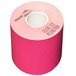 A pink roll of MAXStick thermal paper with white text on it.