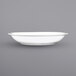 An International Tableware bright white porcelain serving bowl with a rolled edge.
