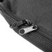 A close-up of a zipper on a black Cardinal Detecto carrying case.