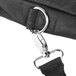 A close-up of a black carrying case with a metal clasp.
