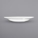 A close-up of a white International Tableware porcelain pasta bowl with a wide rim.