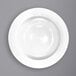 A close-up of an International Tableware Dover wide rim porcelain pasta bowl with a white background.