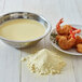 A plate of Golden Dipt fried shrimp with a bowl of Golden Dipt pre-dip batter mix.