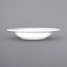 A white International Tableware Bristol porcelain soup bowl with a wide rim on a white surface.