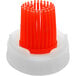 An orange plastic brush cap.